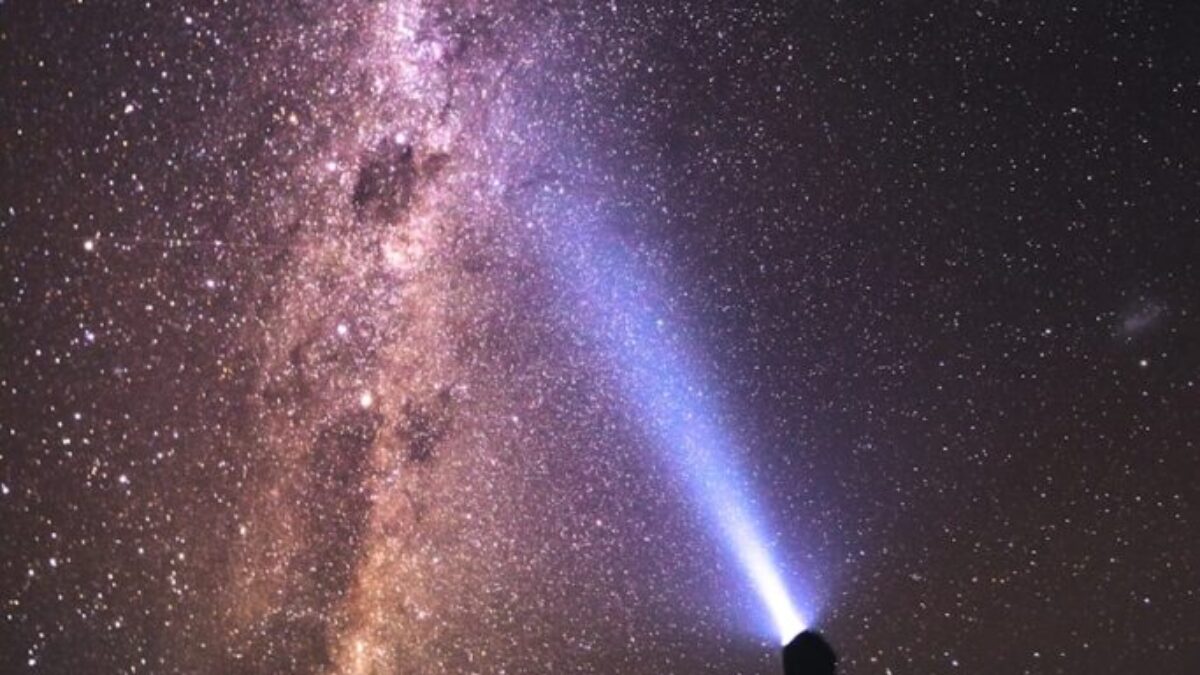 silhouette of man and woman under starry night