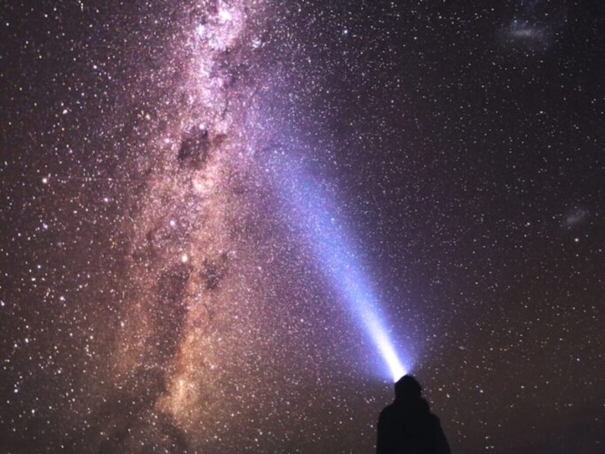 silhouette of man and woman under starry night