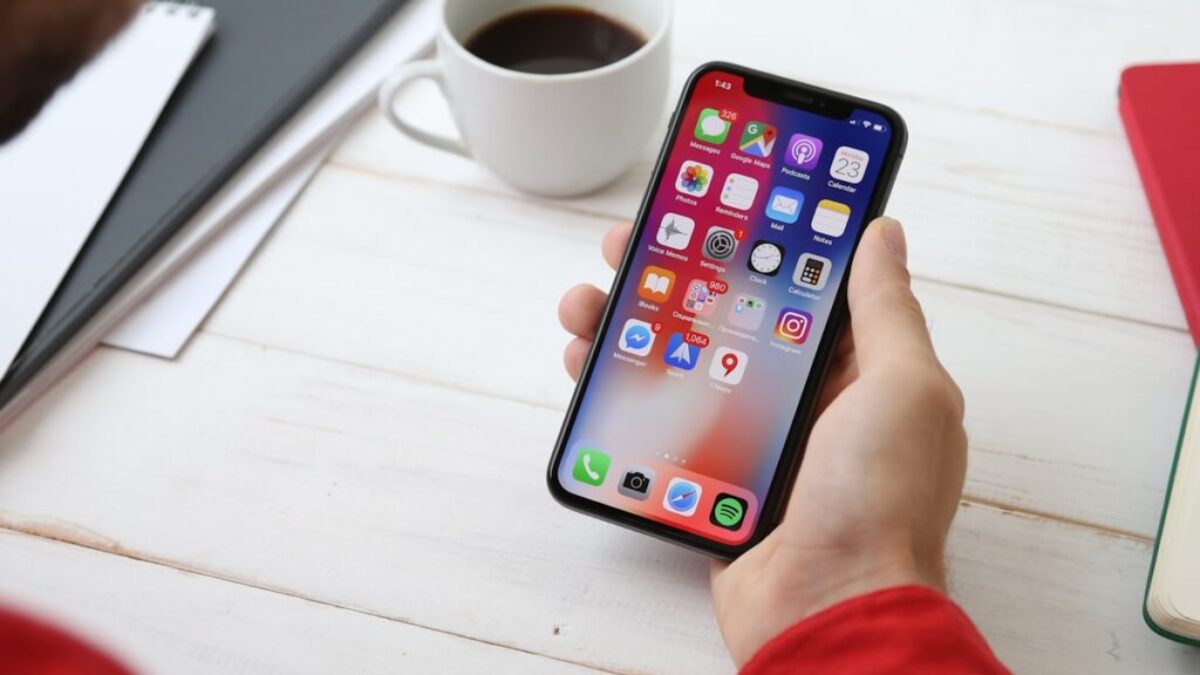 person holding space gray iPhone X