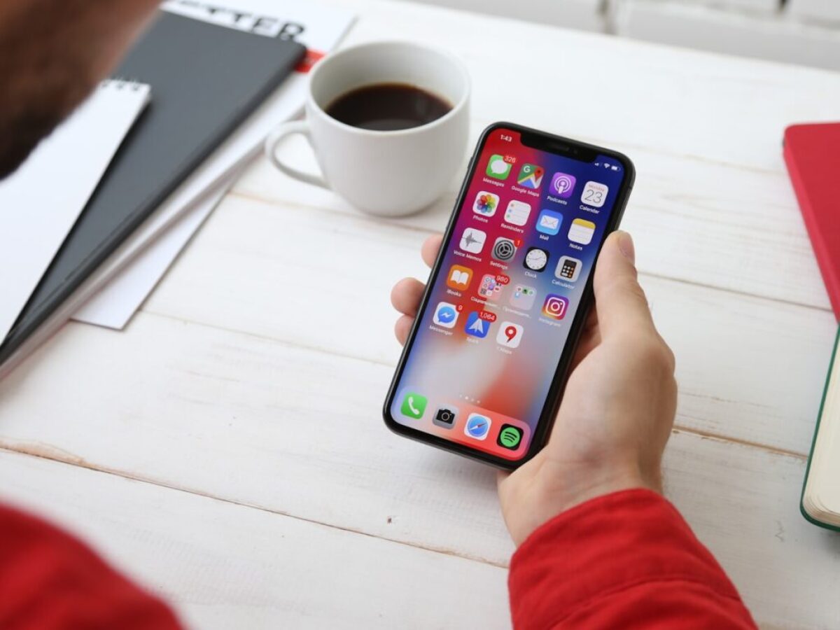 person holding space gray iPhone X