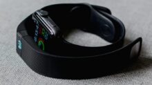 black aluminum case Apple Watch and black Fitbit charge 2