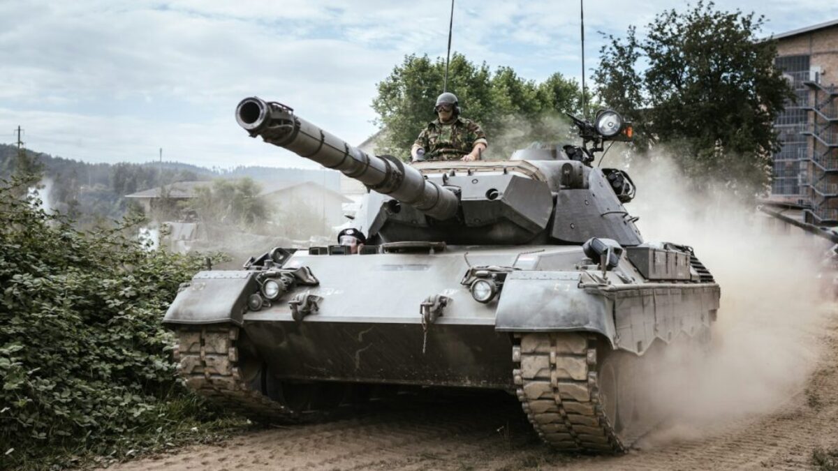 battle tank on green grass field during daytime