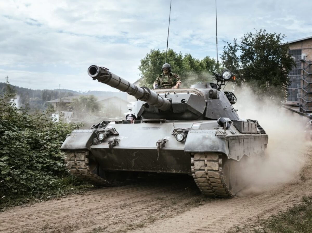 battle tank on green grass field during daytime