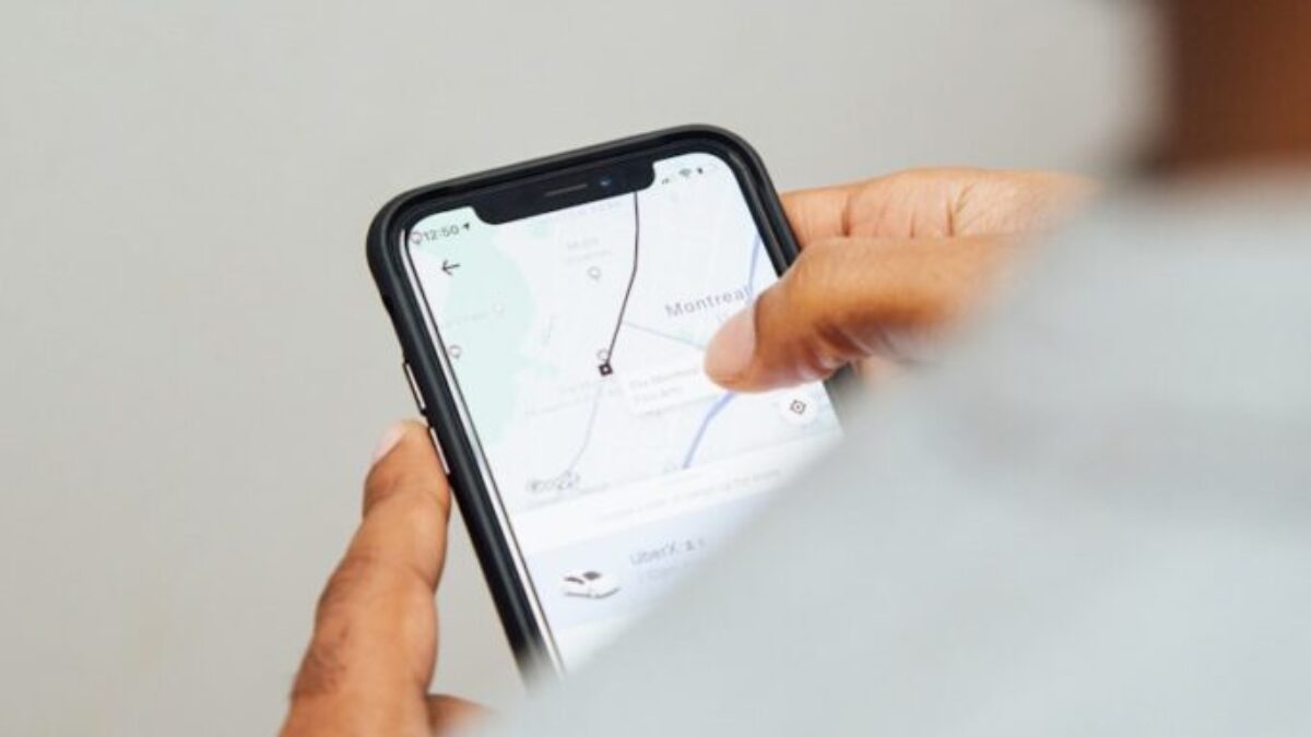 man using turned-on smartphone