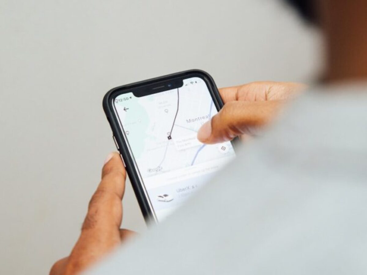man using turned-on smartphone