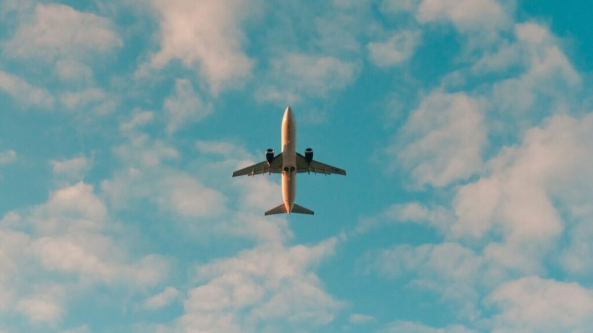 white airplane flying in the sky during daytime