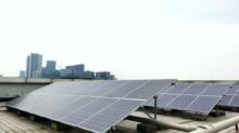 a row of solar panels sitting on top of a roof