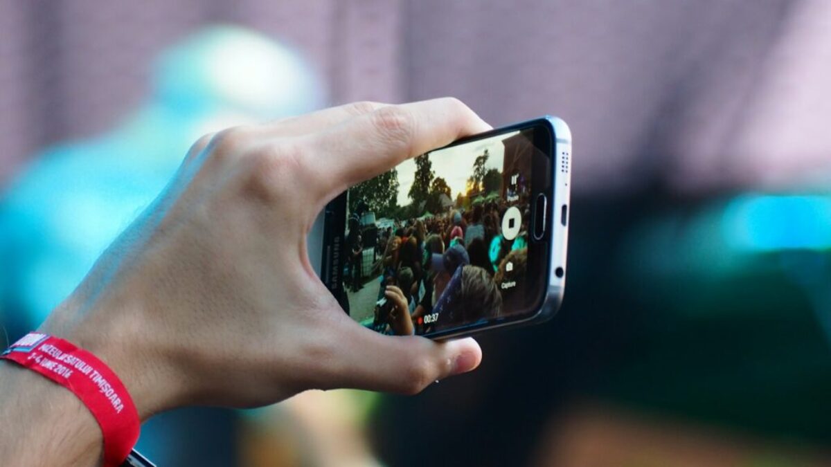 person using black smartphone