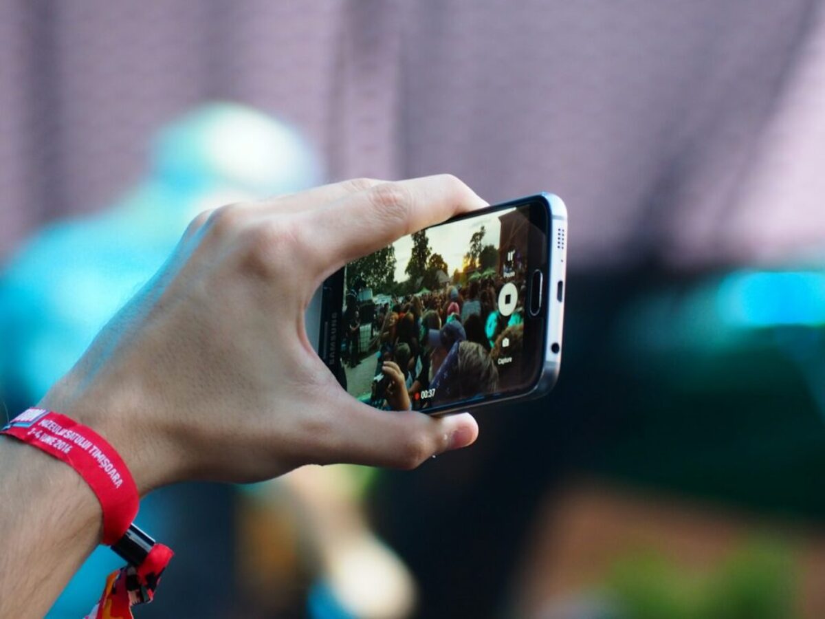 person using black smartphone