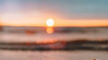 clear glass mason jar on beach during sunset