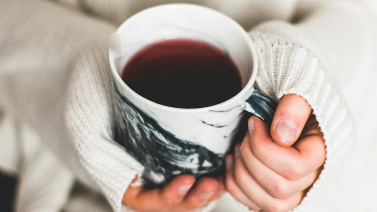 person holding cup of coffee