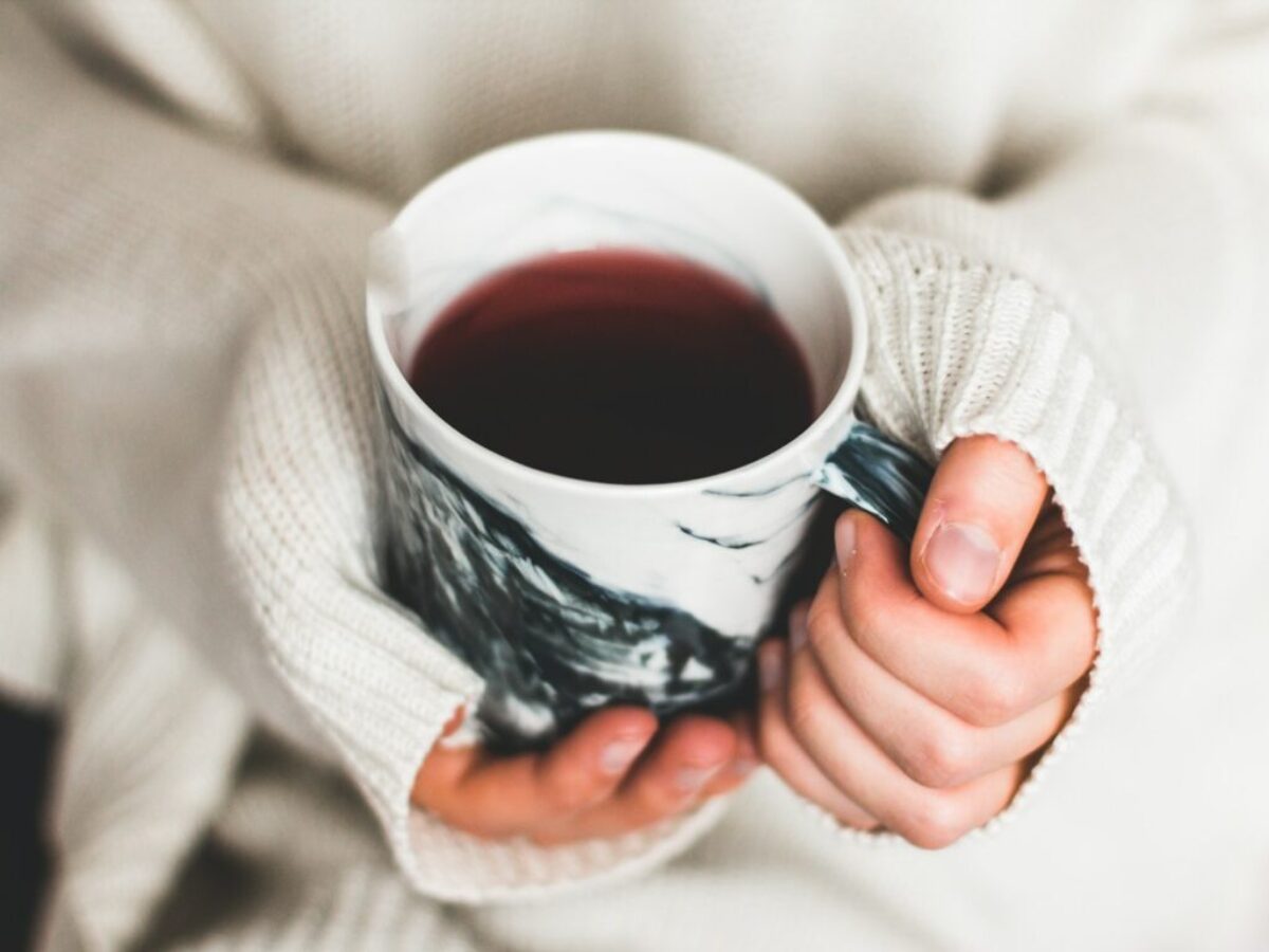 person holding cup of coffee