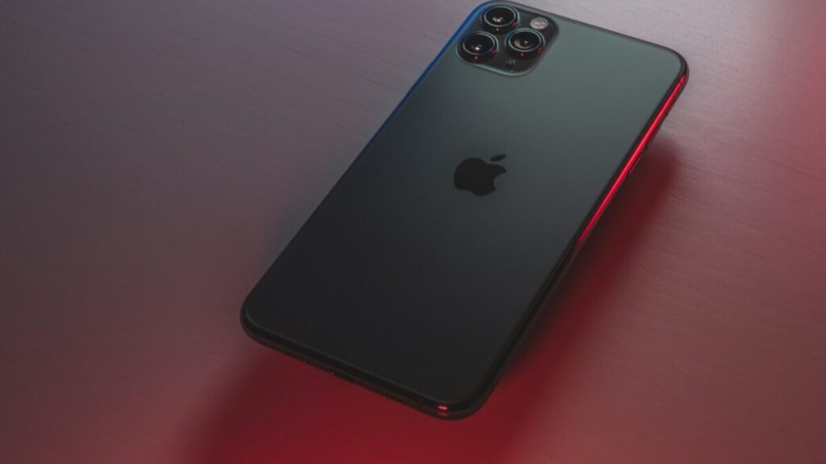 black iphone 7 plus on red table