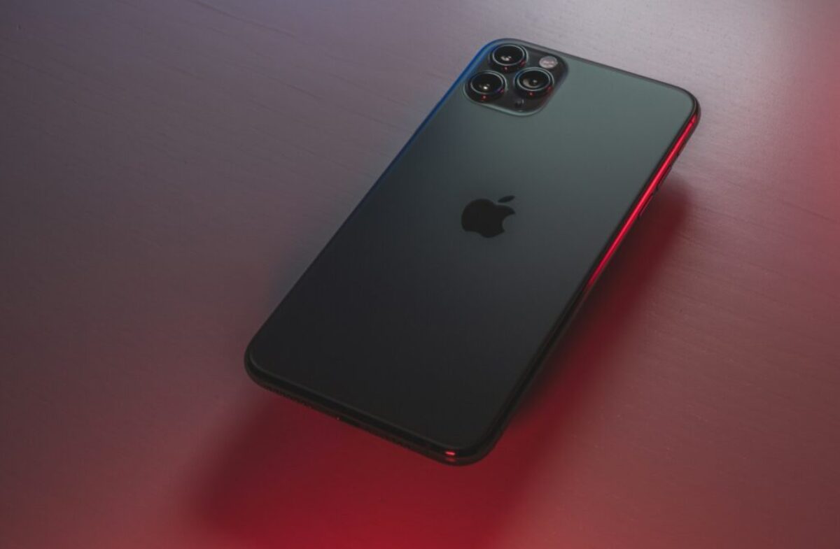 black iphone 7 plus on red table