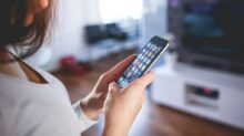 Woman Wearing White V Neck Shirt Using Space Gray Iphone 6