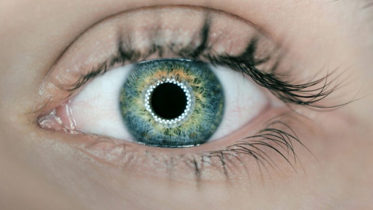 person showing green and black eyelid closeup photography