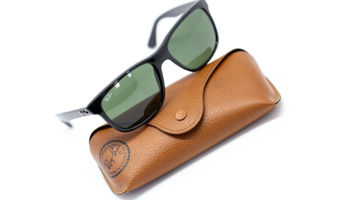 black framed sunglasses on brown leather pouch