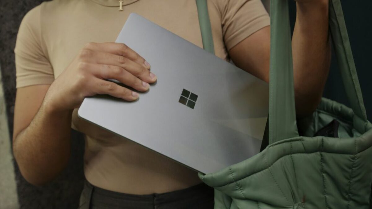 Female putting her Surface laptop in her bag
