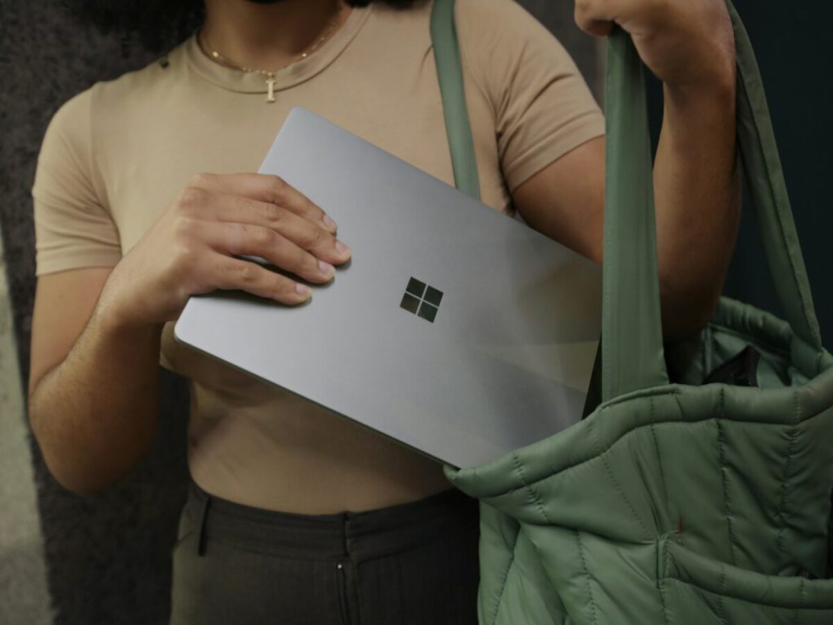 Female putting her Surface laptop in her bag