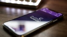 space gray iPhone X smartphone turned on