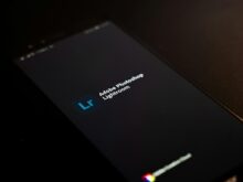 black lenovo laptop computer on black surface