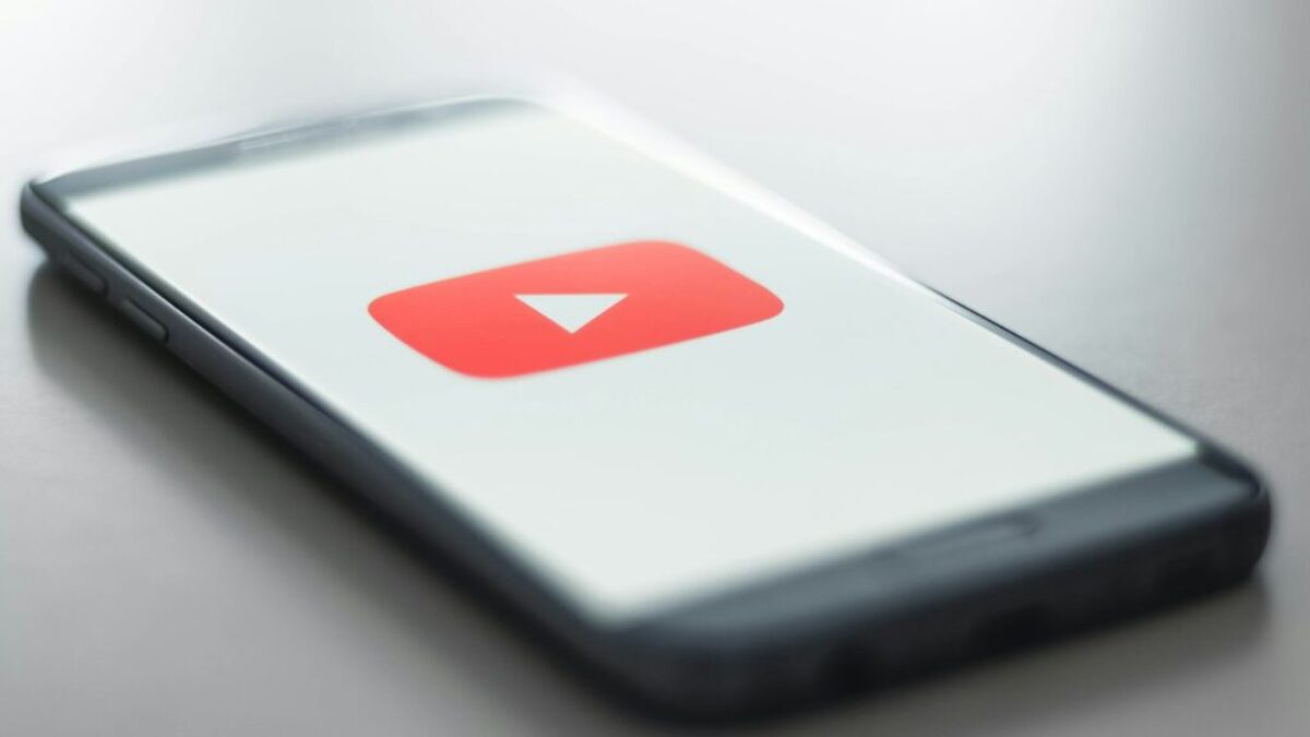 a close up of a cell phone with a youtube logo on it