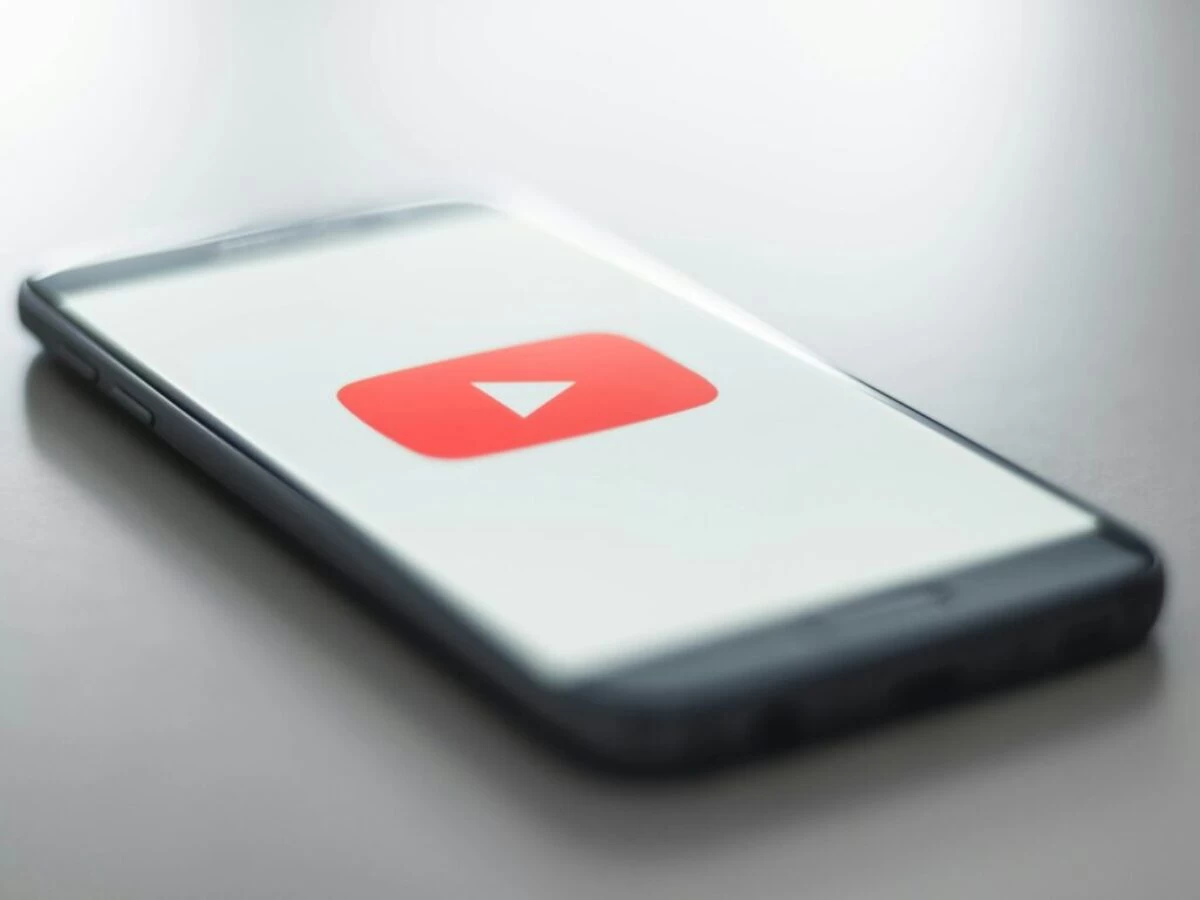 a close up of a cell phone with a youtube logo on it