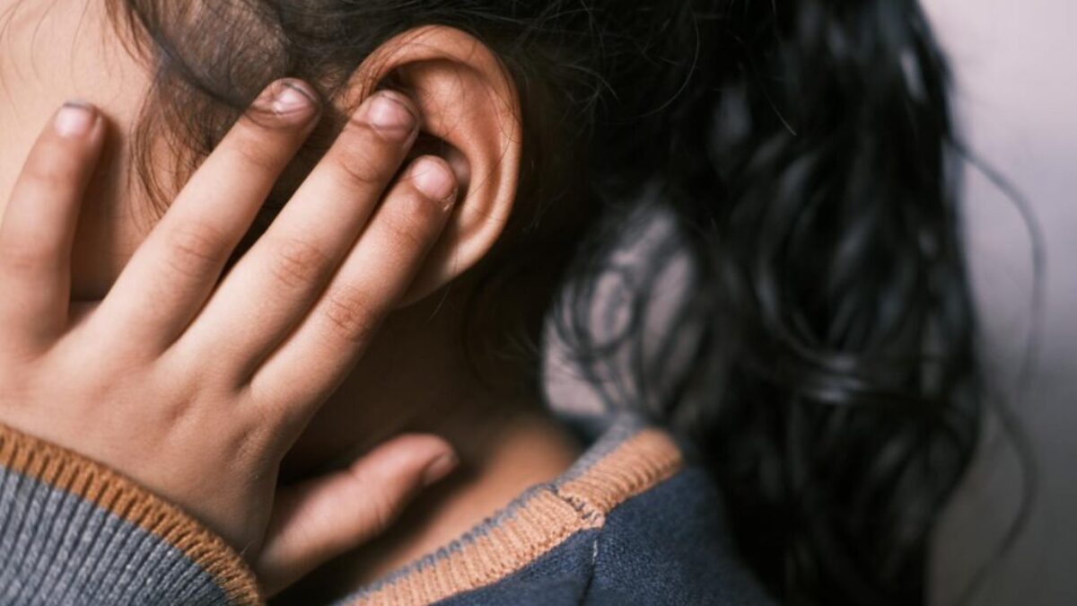 Girl Covering Ear