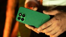 Close-up of a Man Holding a Green Smartphone
