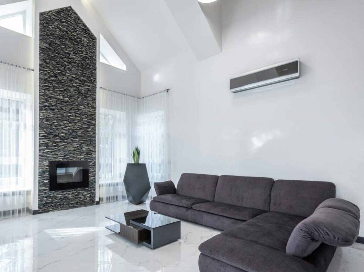 Cozy living room with comfortable sofa and minimalist furniture