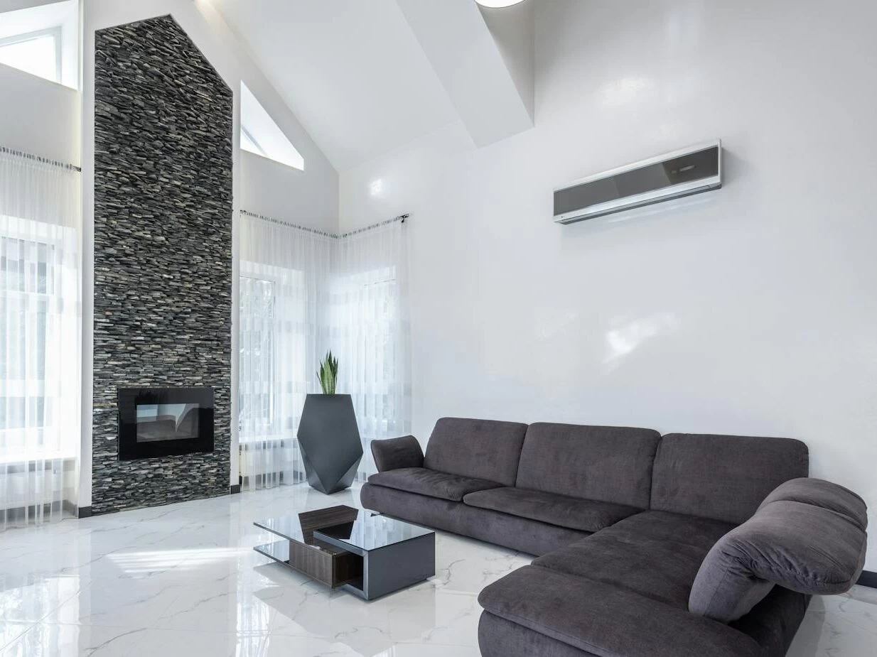 Cozy living room with comfortable sofa and minimalist furniture