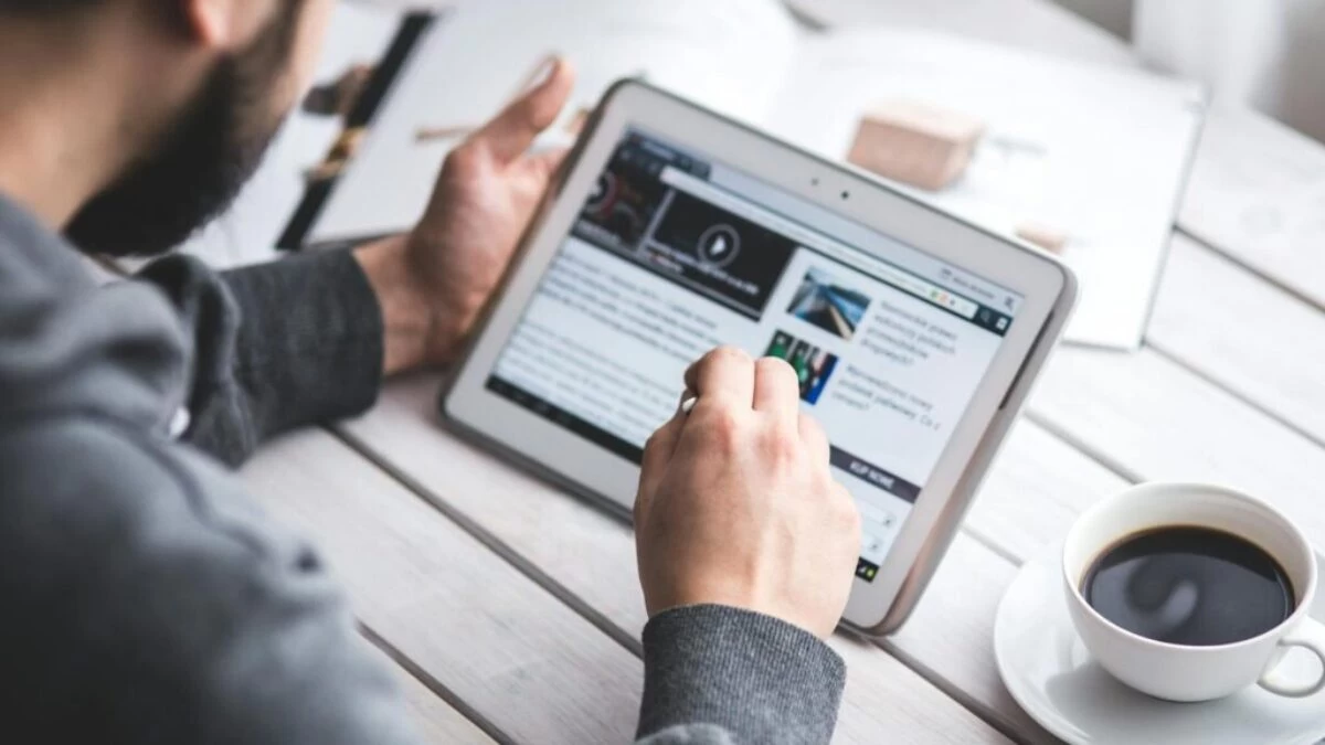 Man using stylus pen for touching the digital tablet screen