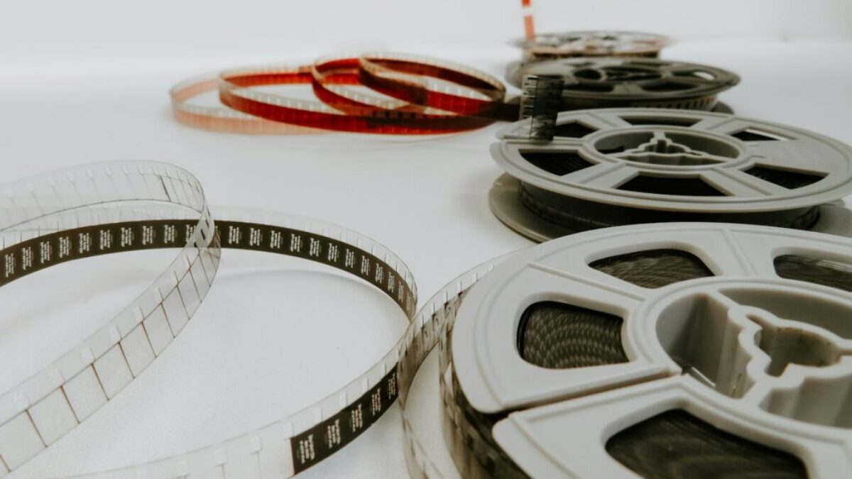 four reel films lying on white table