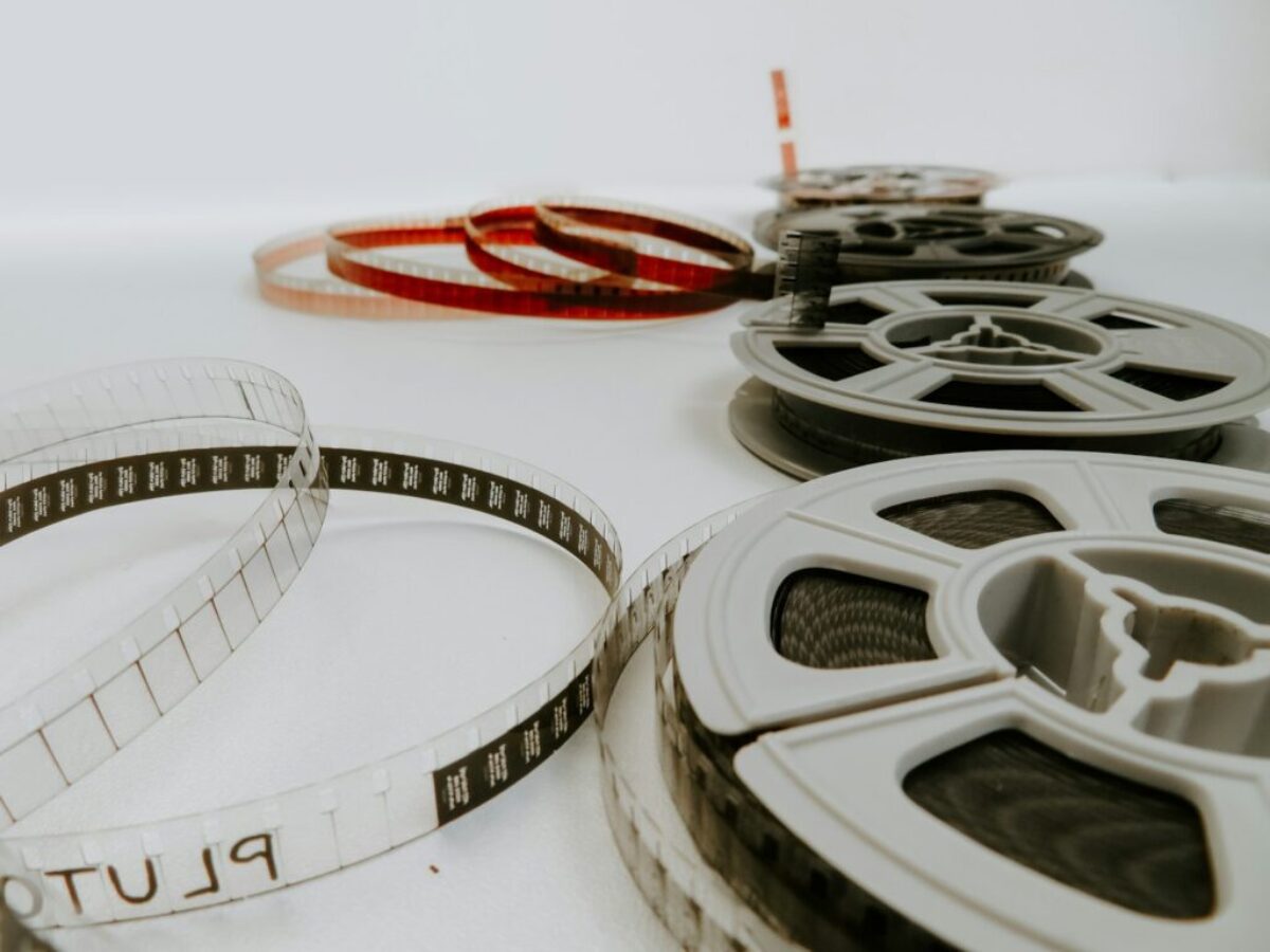 four reel films lying on white table