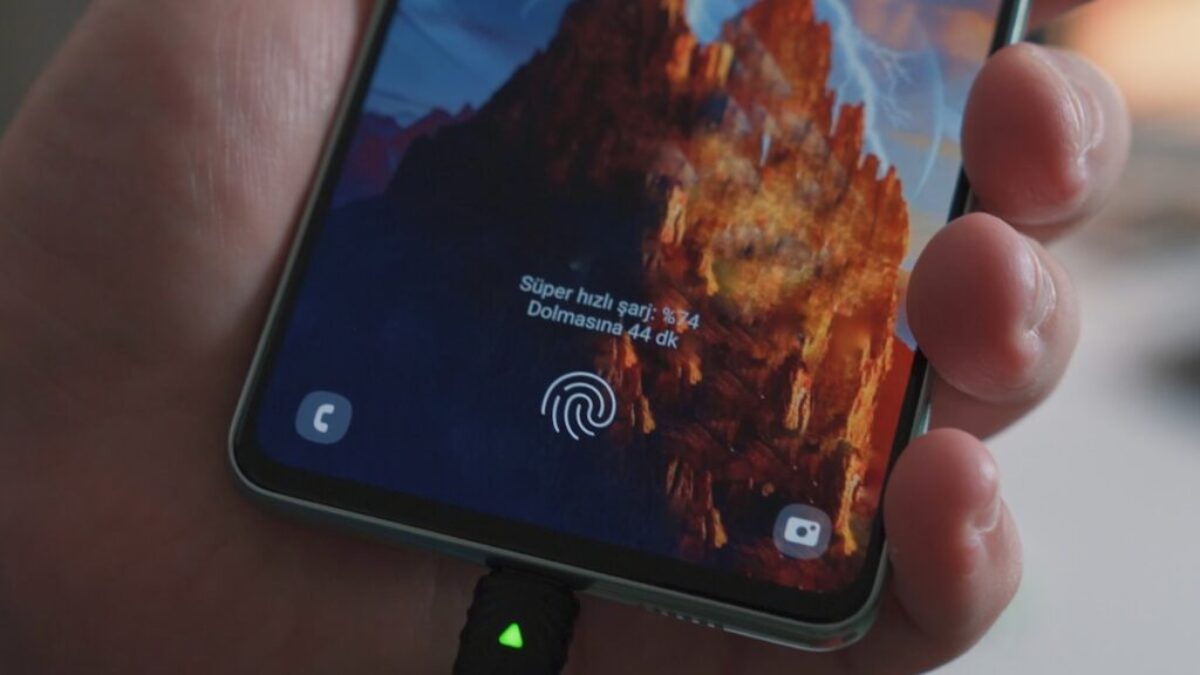 a hand holding a cell phone