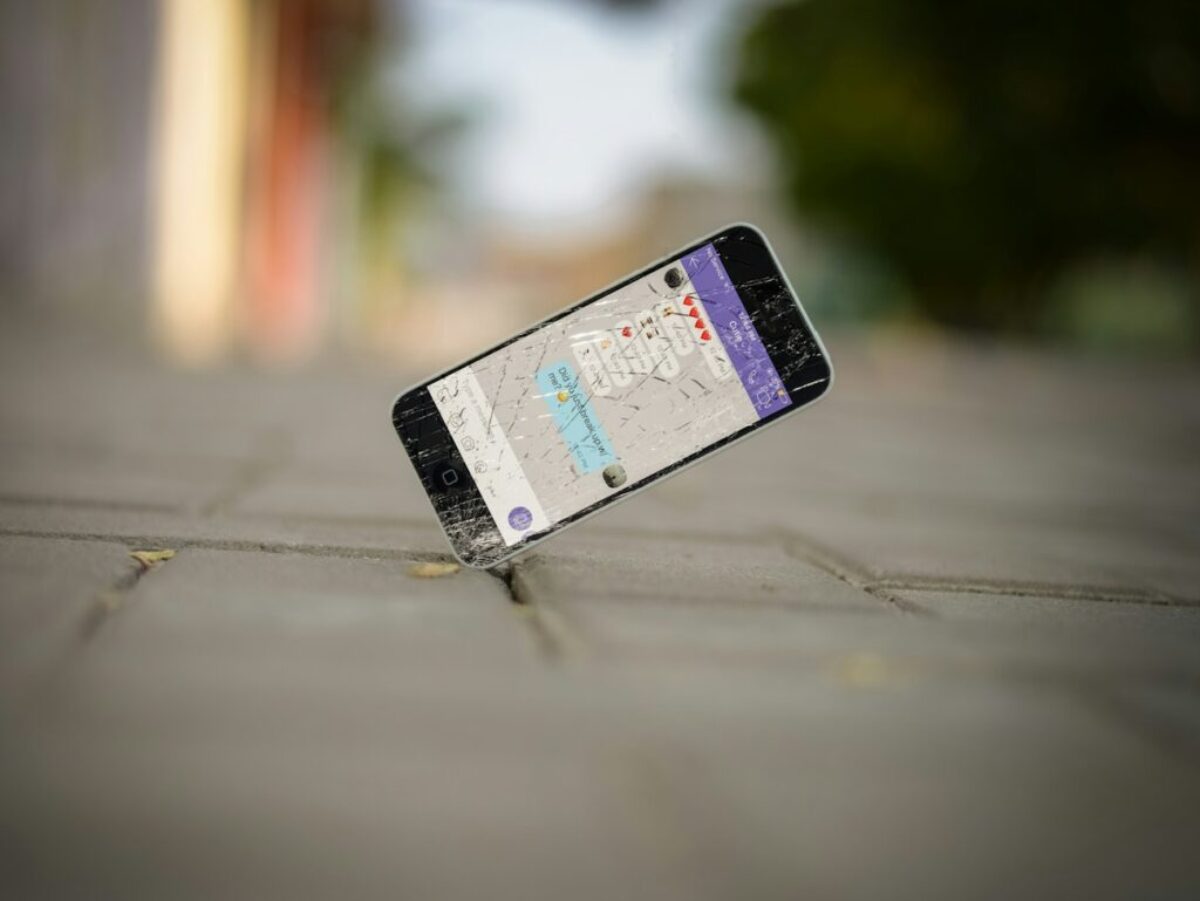 selective focus photo of iPhone balance on brick pavement