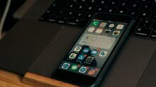 black iphone 4 on black laptop computer