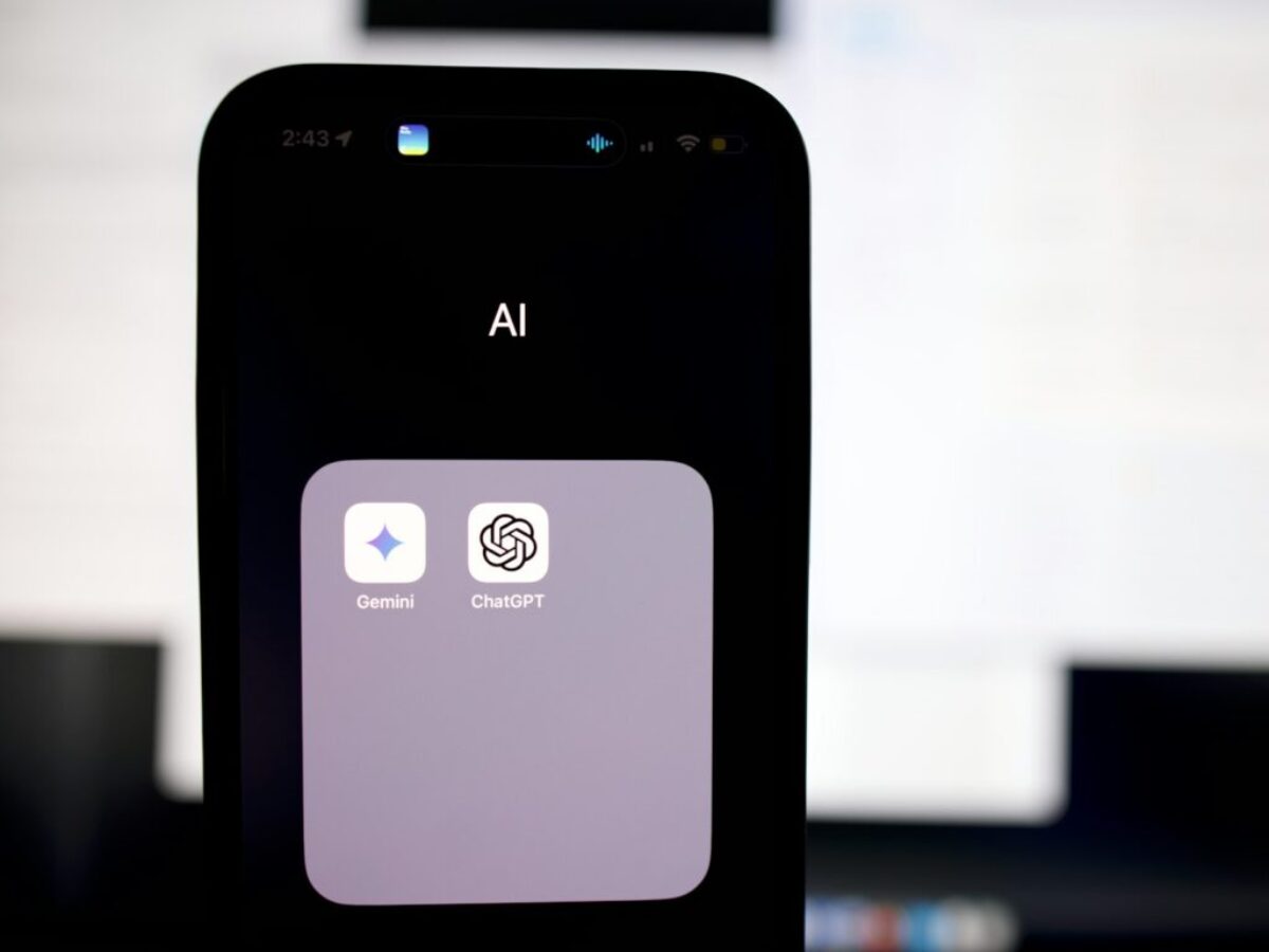 a close up of a cell phone with an ai button