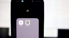 a close up of a cell phone with an ai button