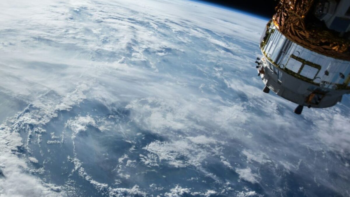 view of Earth and satellite