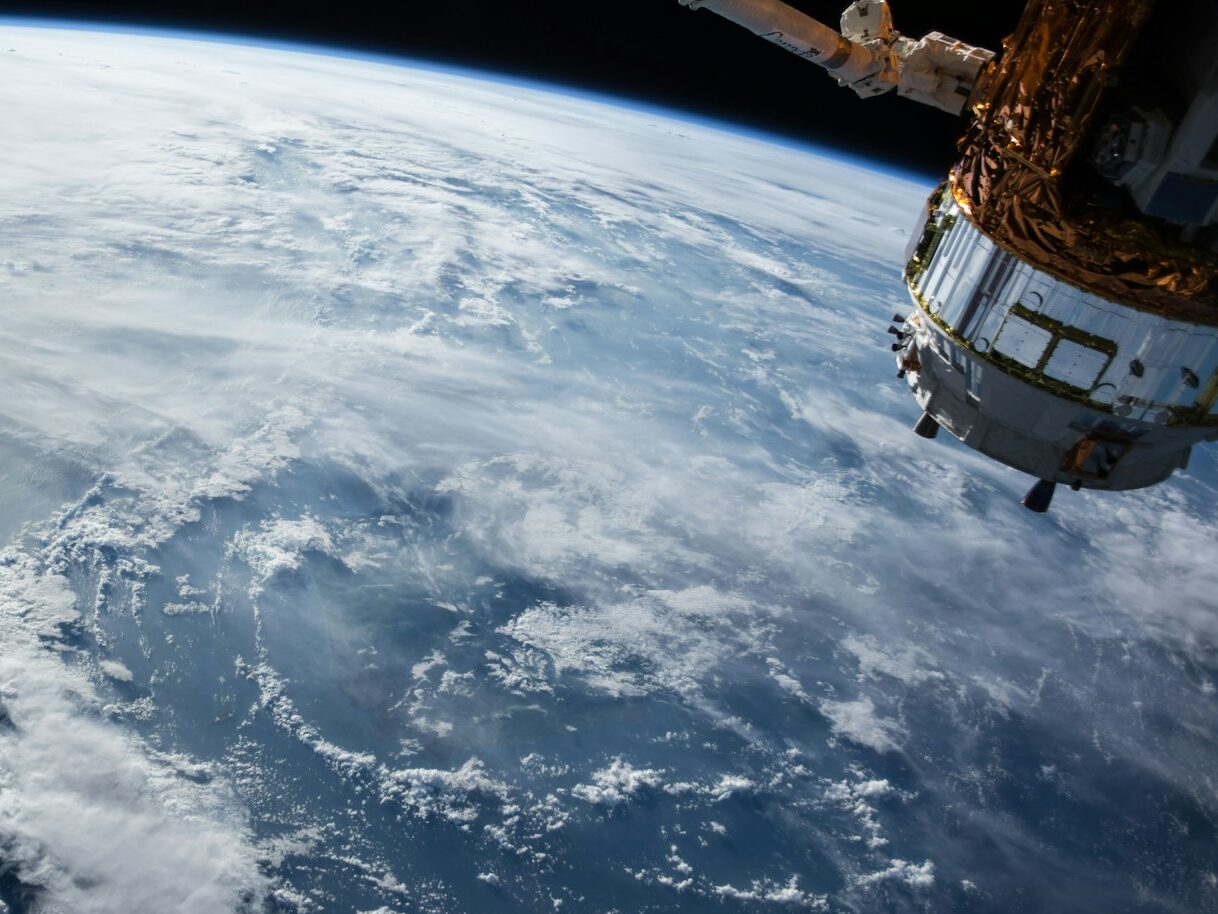 view of Earth and satellite