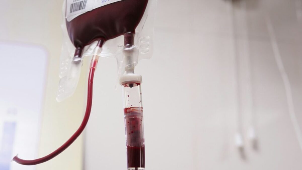 a blood test tube with a blood dropper attached to it