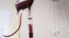 a blood test tube with a blood dropper attached to it
