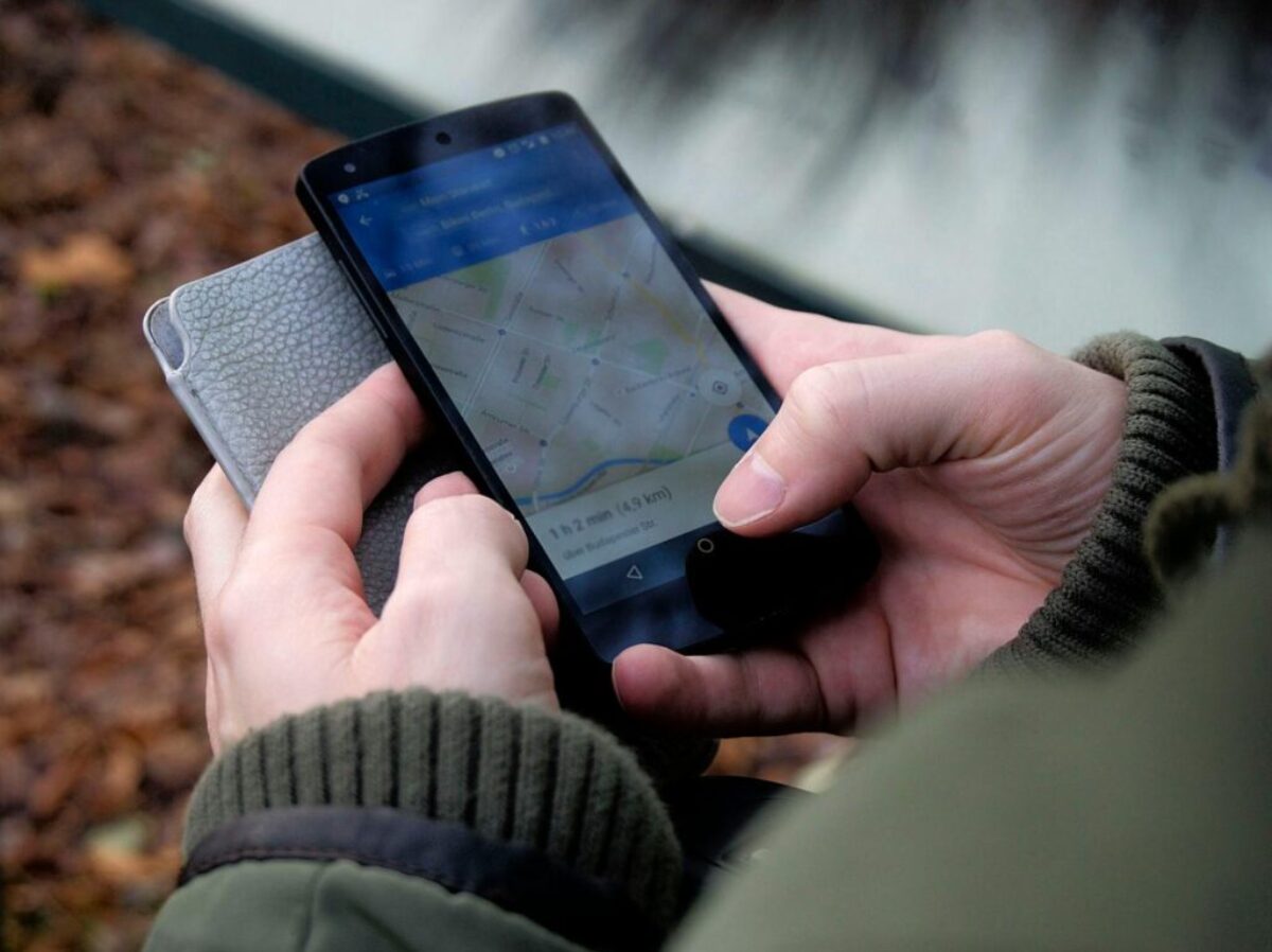 Person Using Google Maps Application Through Black Android Smartphone