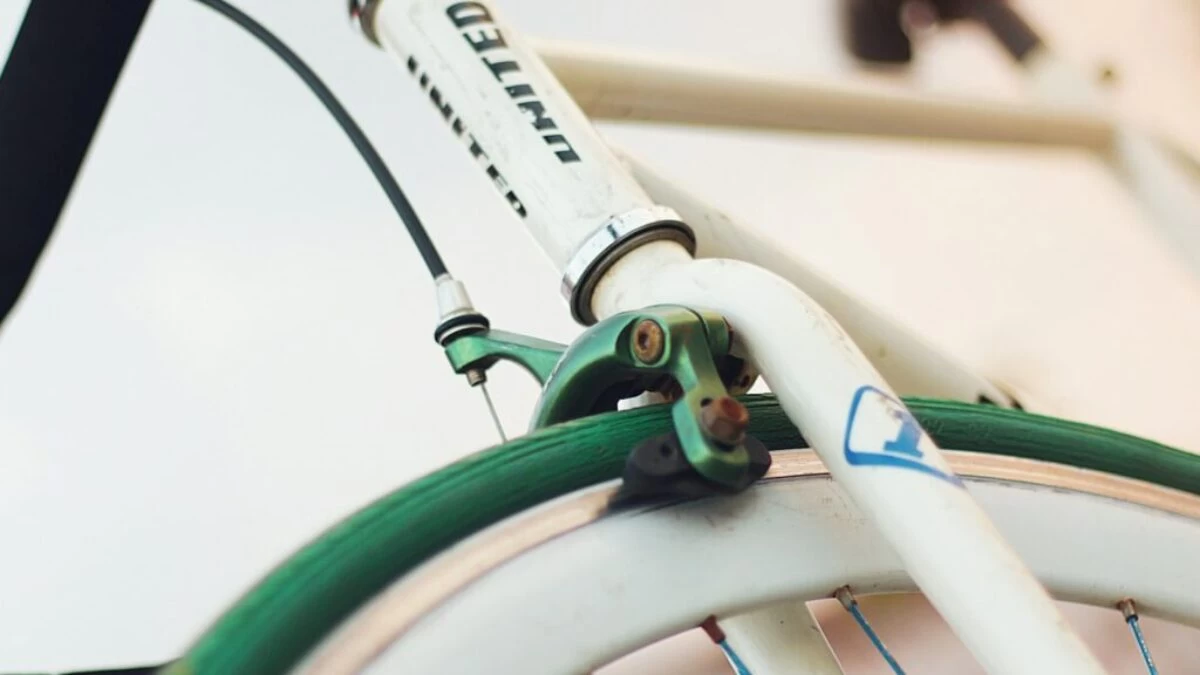 white and green bicycle with green handle bar