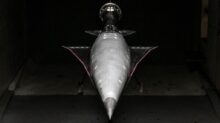 an airplane is shown in a dark room