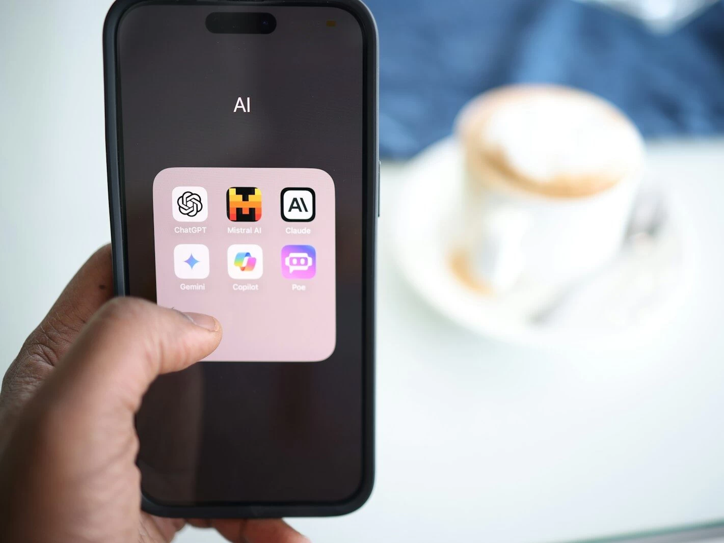a person holding a cell phone in their hand