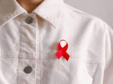 Man Wearing Red Ribbon