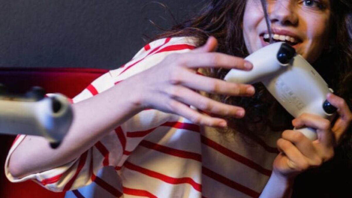 A Woman in Striped Shirt Holding a Game Controller