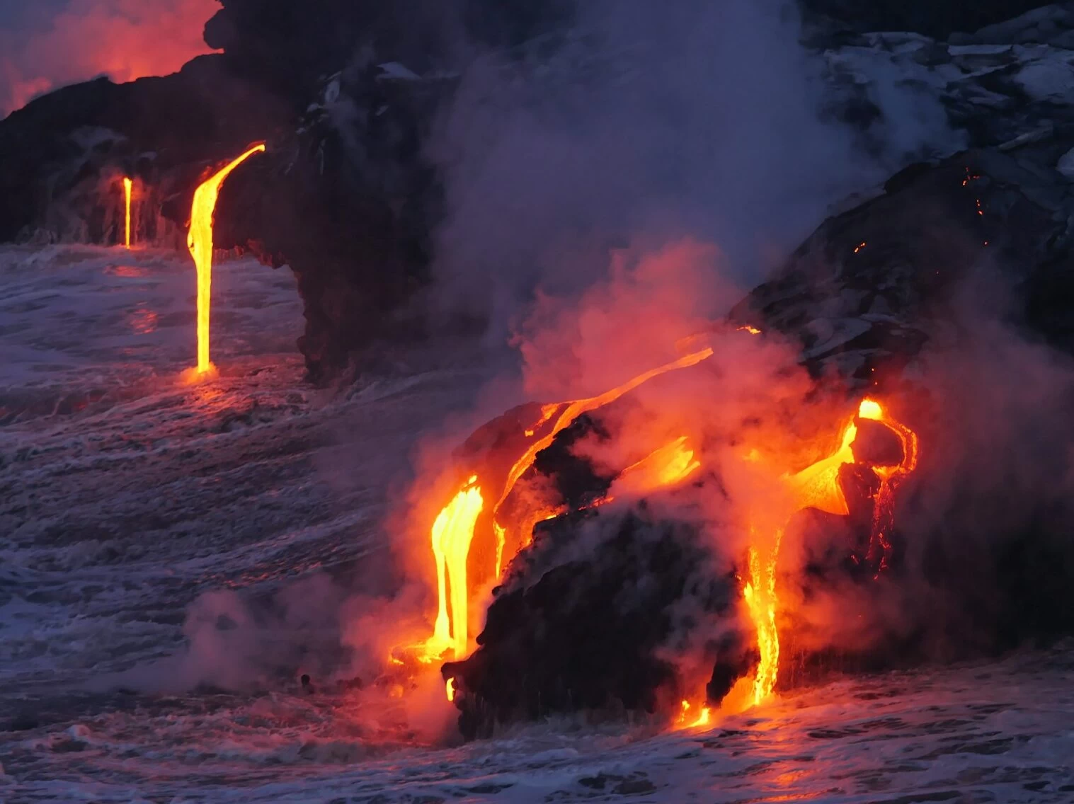 photo of lava flowing on land